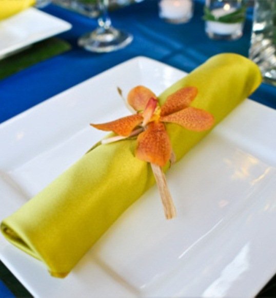 orange Mokara orchid wedding table decorations