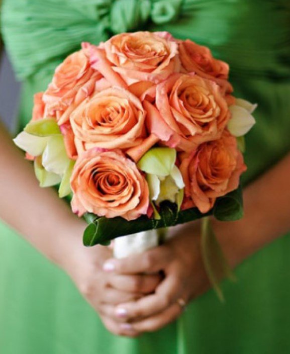 Green Brides maids dress with Coral Orange Bridesmaids bouquet