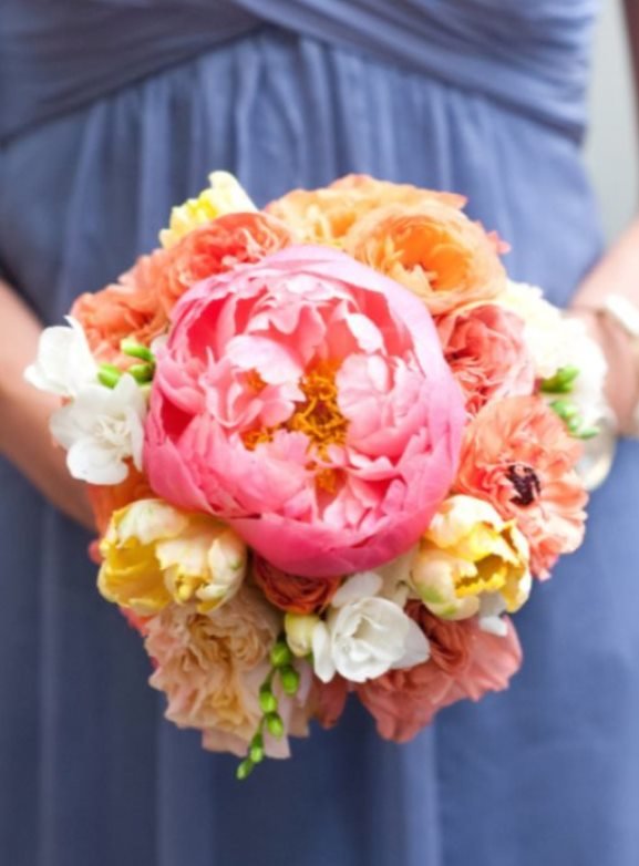 Lavender bridesmaids dress with pink orange bouquet