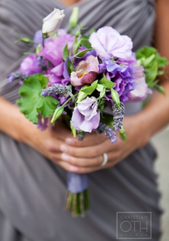 Silver bridesmaids dress with purple and lavender bridesmaids bouquet